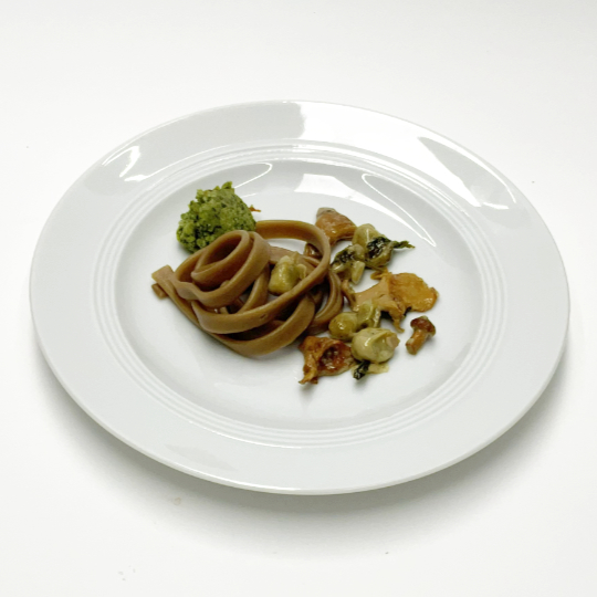 Liquorice pasta with beand and chanterelles